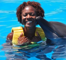 Being kissed by a dolphin in Mexico (2010). This was the BEST experience ever! Yes, I was TERRIFIED!